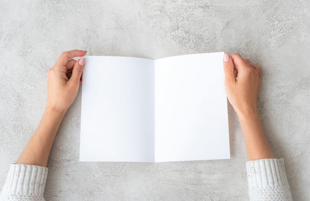 Girl' hands holding sheet of paper